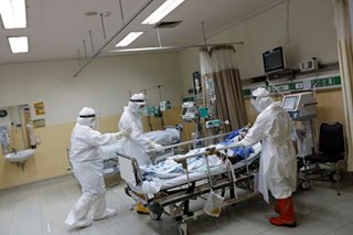 Coronavirus patients flood hospitals in Indonesia's second-largest city