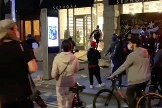 New York under curfew as looters hit luxury stores