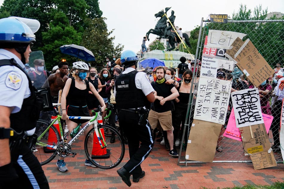 Protesters clash with police officers in Lafayette park