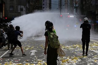 Hong Kong police fire water cannon at crowds protesting new security law