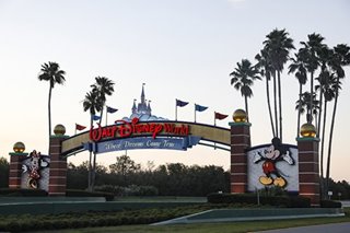 Disney World reopens as US virus death toll surges