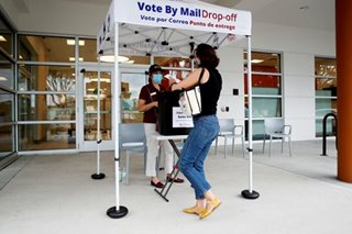 US plows ahead with mail-in voting despite ballot errors