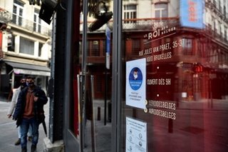 Belgian café owner holds sleep-in to protest virus shutdown