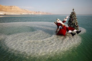 Swimming Santa brings Dead Sea to life with tree and cheer