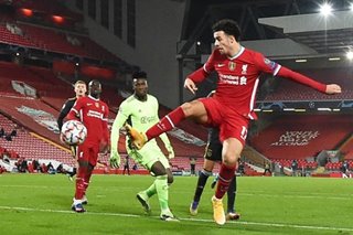 Football: Liverpool advance in Champions League