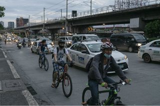 When the trains stopped, cyclists dodged Manila’s choking traffic