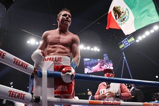 Boxing: Mexico's Alvarez overpowers Britain's Smith to claim two titles