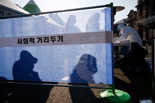 S.Korea reports record daily coronavirus deaths, raids