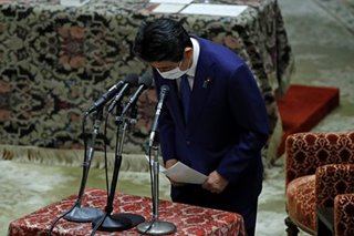 Abe grilled in Diet after fixing false statements on funding scandal