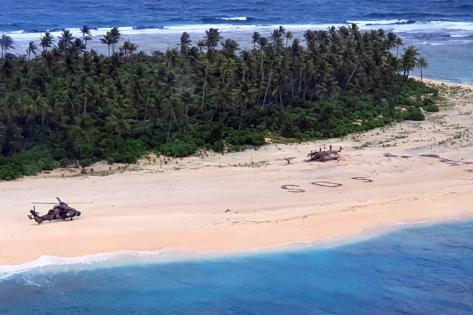 3 men marooned in the Pacific are rescued after writing SOS in the sand 1