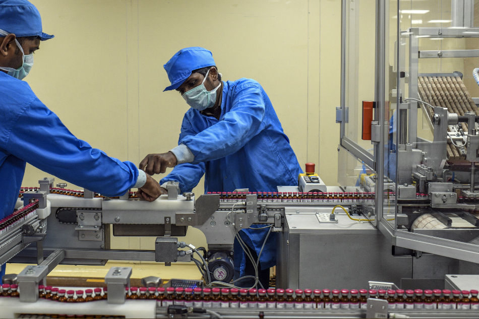 Work on a vaccine assembly line at the Serum Institute in Pune, India, on July 10, 2020. Atul Loke, The New York Times/File