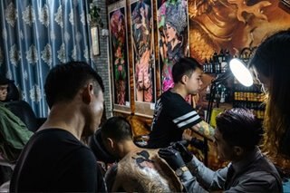 Chinese city orders taxi drivers to remove tattoos (for the women and children)
