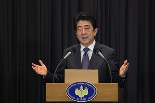 Abe returns to work as questions linger about state of his health