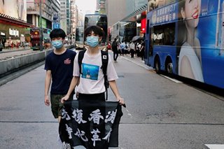Riot police chase Hong Kong Mother's Day protesters