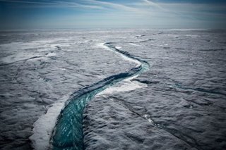 Sea level rise quickens, as Greenland ice sheet sheds record amount