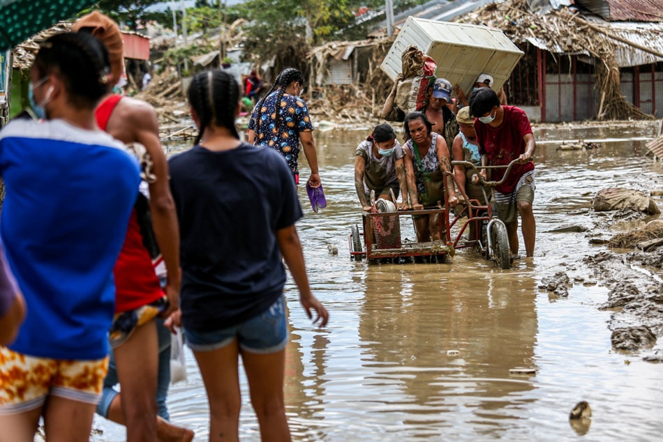 IN PHOTOS: Kasiglahan residents grapple with TY Ulysses impacts; climate emergency declaration pushed 8