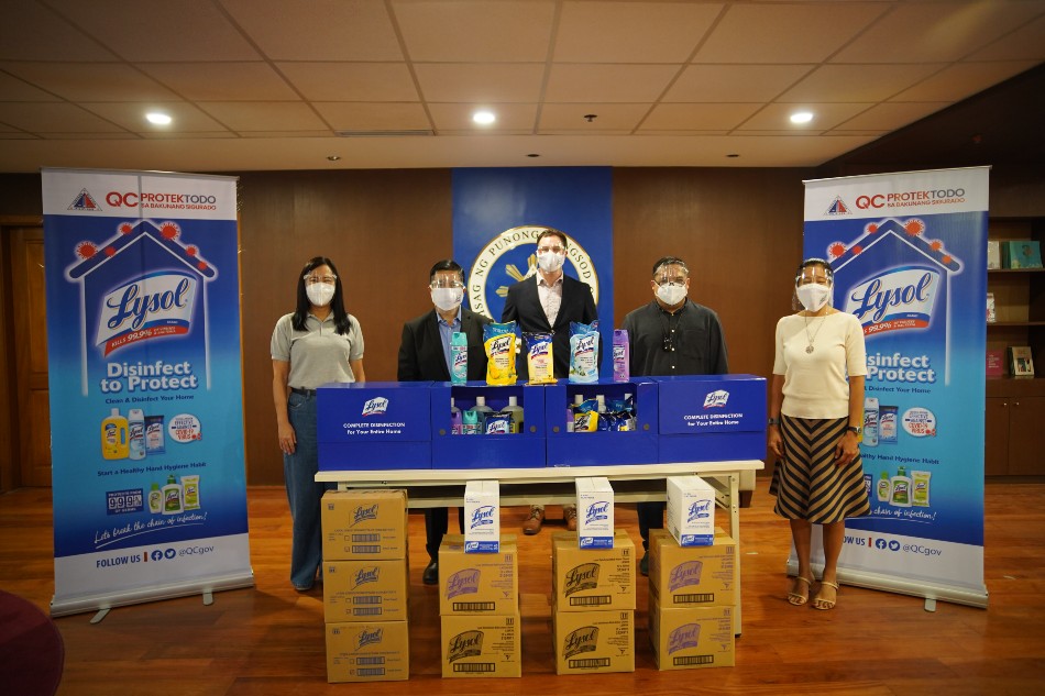 Quezon City Mayor Joy Belmonte (leftmost) and Reckitt PH General Manager Aleli Arcilla (rightmost) leading the ceremonial turnover of product donations. Photo source: Lysol