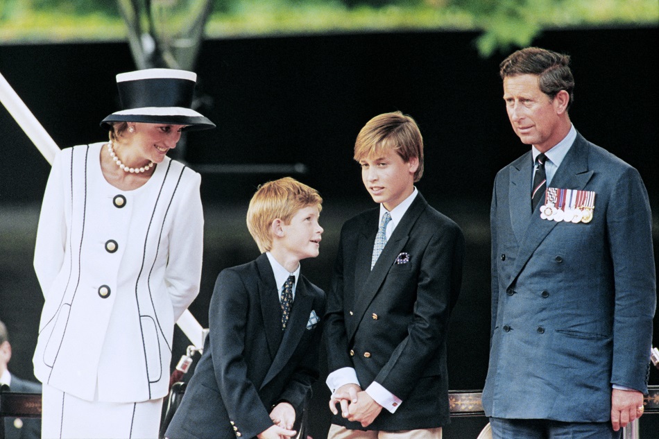 Princess Diana (from left), sons Harry and William, and Prince Charles watch the march past on a dais on the mall as part of the commemorations of VJ Day on August 19, 1995. Johnny Eggitt, AFP/file