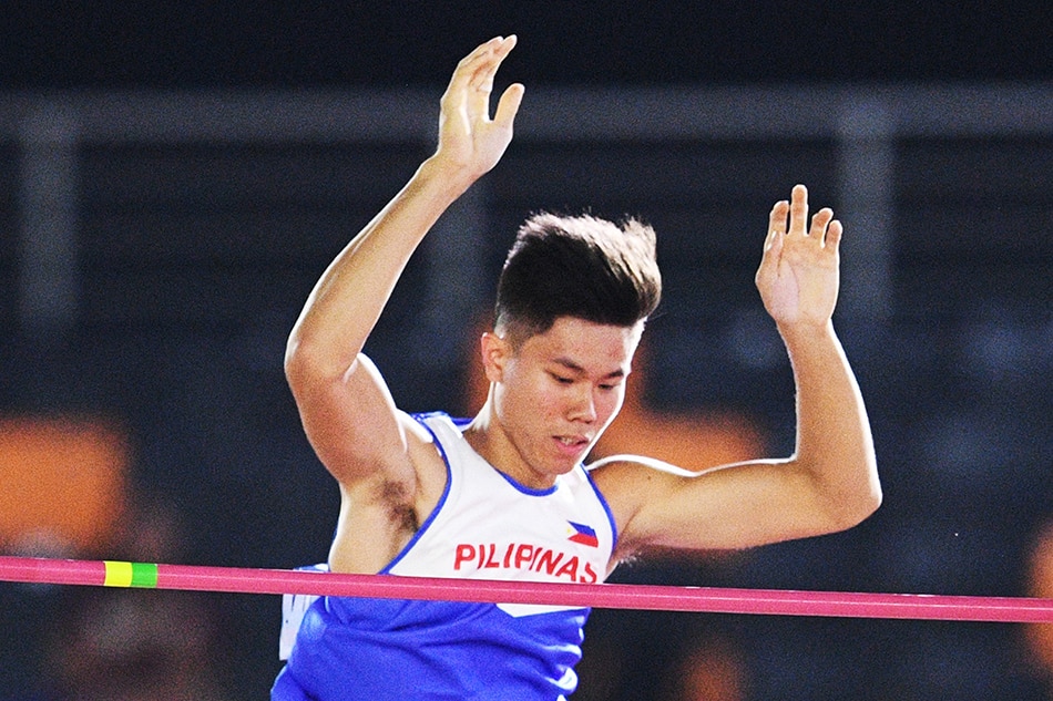 Ernest John Obiena clears the bar in the men's pole vault athletics event at the SEA Games (Southeast Asian Games) in the athletics stadium in Clark City on December 7, 2019. Ted Aljibe, AFP/File