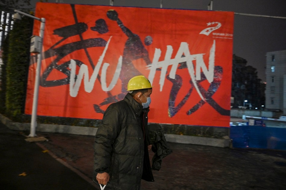 A man walks along a street in Wuhan 