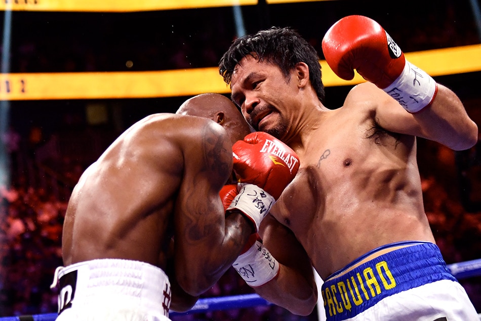 Manny Pacquiao (R) of the Philippines fights against Yordenis Ugas of Cuba during the WBA Welterweight Championship boxing match at T-Mobile Arena in Las Vegas, Nevada on Aug. 21, 2021. Patrick T. Fallon, AFP/File 