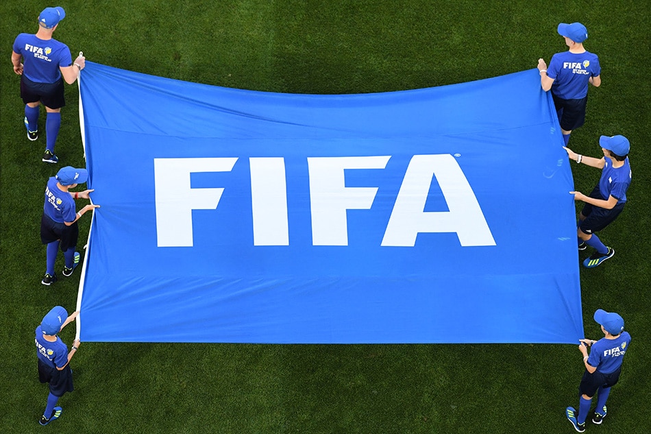 The FIFA flag is displayed prior to a Russia 2018 World Cup match in June 2018. Kirill Kudryatsev, AFP/file