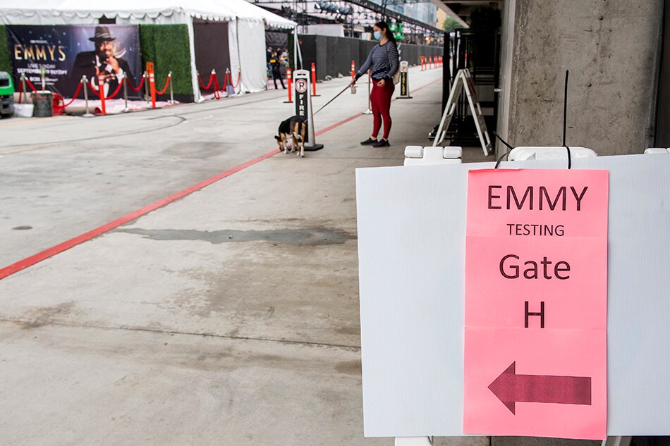 A sign indicates a COVID-19 testing site where people must be tested before accessing the red carpet for the Emmy Awards 2021 at L.A. Live, in Los Angeles, California, September 17, 2021. The 73rd Primetime Emmy Awards will be held on Sunday, September 19, 2021. Valerie Macon, AFP