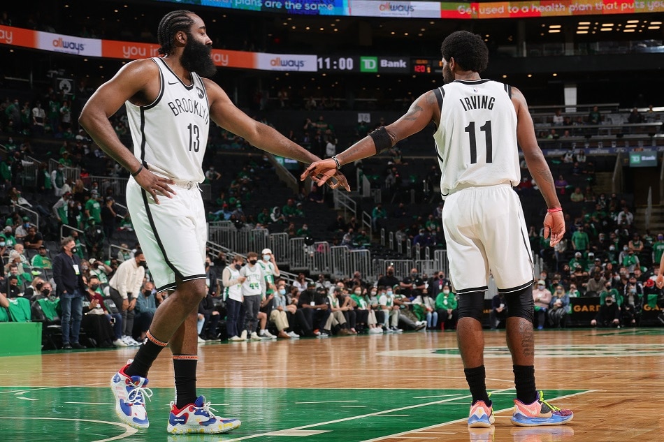James Harden and Kyrie Irving react to a play in the game against the Celtics in the 2021 NBA Playoffs on May 28, 2021 in Boston. Nathaniel S. Butler, NBAE via Getty Images/AFP/file