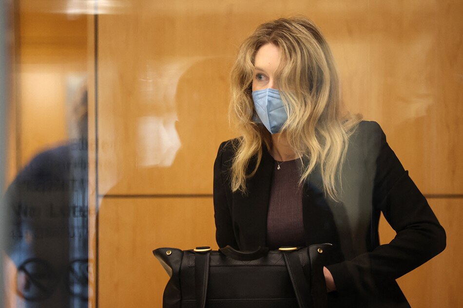 Theranos founder and former CEO Elizabeth Holmes goes through security after arriving for court at the Robert F. Peckham Federal Building September 17, 2021 in San Jose, California. Justin Sullivan, Getty Images via AFP