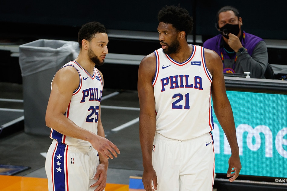 In this file photo taken on February 12, 2021 Ben Simmons #25 and Joel Embiid #21 of the Philadelphia 76ers talk during the NBA game at Phoenix Suns Arena on February 13, 2021 in Phoenix, Arizona. Christian Petersen, Getty Images North America/AFP.