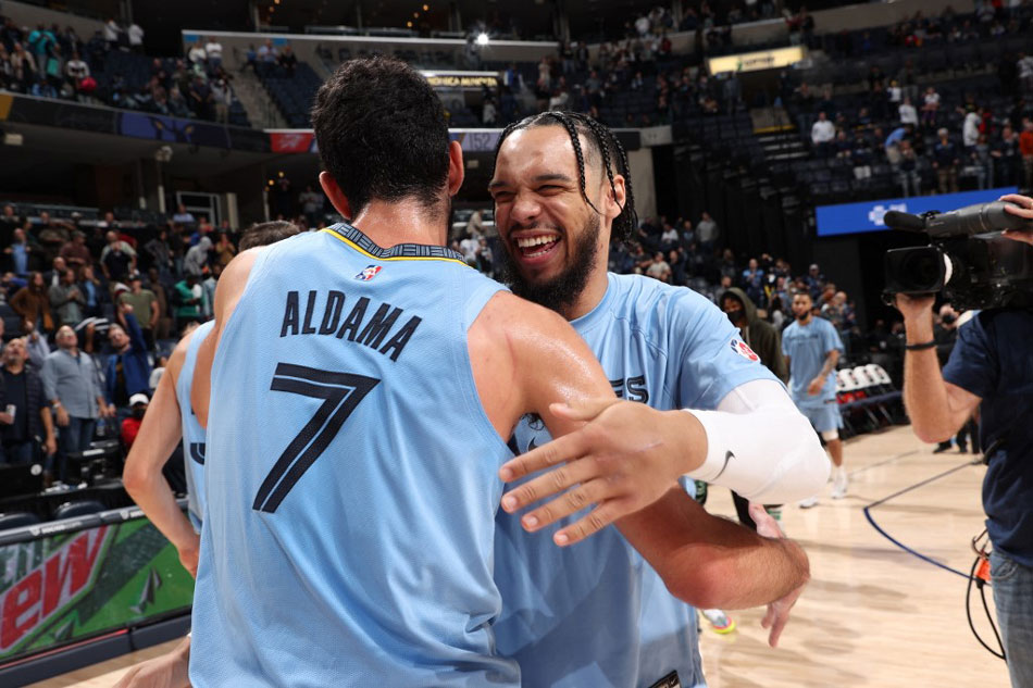 Dillon Brooks (24) and Santi Aldama (7) of the Memphis Grizzlies celebrate after a game against the Oklahoma City Thunder at FedExForum in Memphis, Tennessee. Joe Murphy, NBAE via Getty Images/AFP