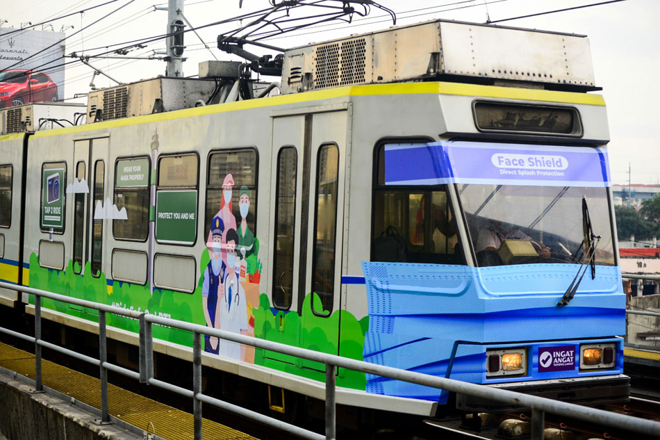 The LRT-1 launches a train featuring a giant face mask and face shield at the front and caricatures of frontliners on the side. December 7, 2020. Mark Demayo, ABS-CBN News/File