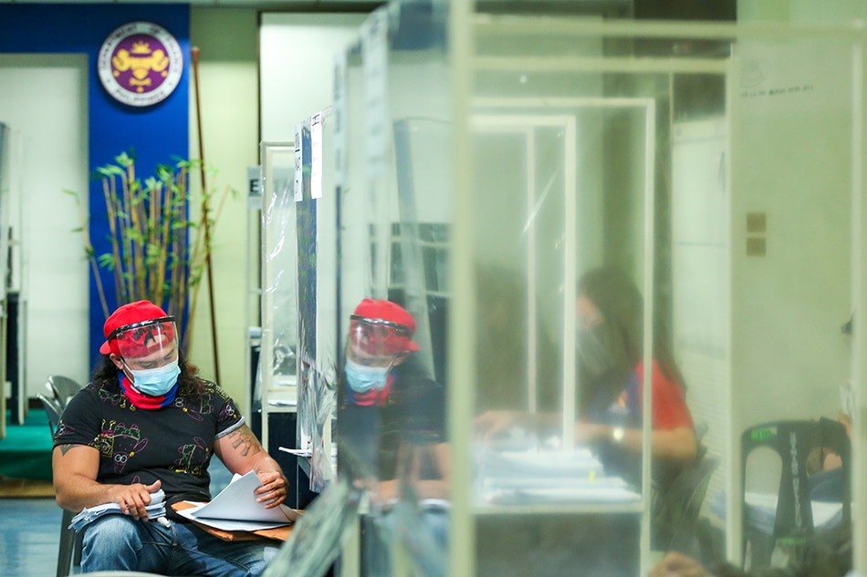 Taxpayers observe minimum health protocols as they file their Annual Income tax Return at a Bureau of Internal Revenue (BIR) tax filing center at the Fisher mall in Quezon City on April 15, 2021. Jonathan Cellona, ABS-CBN News/File