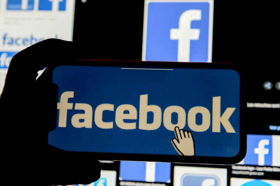 The Facebook logo is displayed on a mobile phone in this picture illustration taken December 2, 2019. Johanna Geron, Reuters/Illustration/File Photo