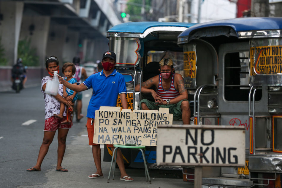 Jeepney drivers wait for motorists in front of their jeepney parking area as they solicit help along Rizal Avenue in Manila on June 22, 2020. Jonathan Cellona, ABS-CBN News file photo