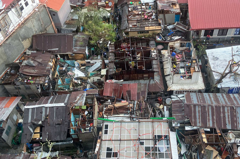 People clear the debris from their homes in Mabolo-Kasambagan area in Cebu on December 17, 2021. Courtesy of Henryl Moreño