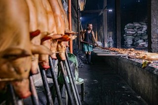 Preparing lechon for the Christmas rush