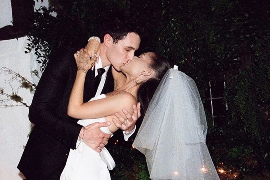 Ariana Grande and Dalton Gomez during their wedding. Photo formerly posted on Grande's Instagram account.