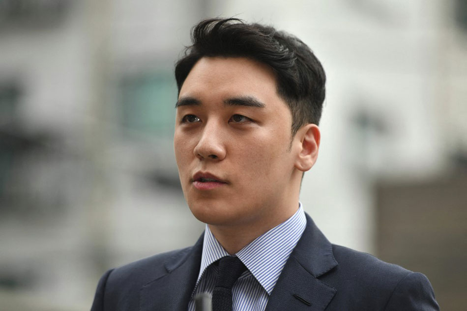 This file photo taken on August 28, 2019 shows former BIGBANG boyband member Seungri, real name Lee Seung-hyun, speaking to the media as he arrives for police questioning in Seoul. Jung Yeon-je, AFP