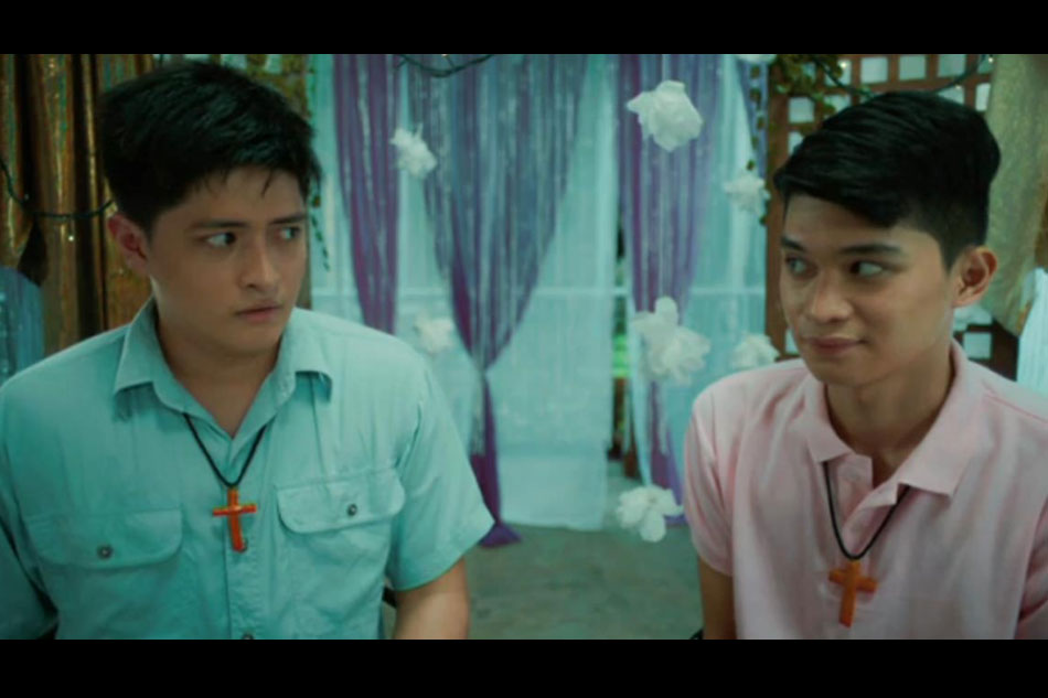 Luke (Keann Johnson) and Dominic (Adrian Lindayag) listen to fortune teller Baby R’s (Iyah Mina) forecast about their relationship. Screenshot from 
