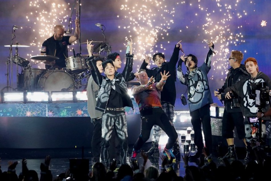 Coldplay and BTS perform during the Annual American Music Awards at the Microsoft Theatre in Los Angeles, California, U.S., November 21, 2021. REUTERS/Mario Anzuoni