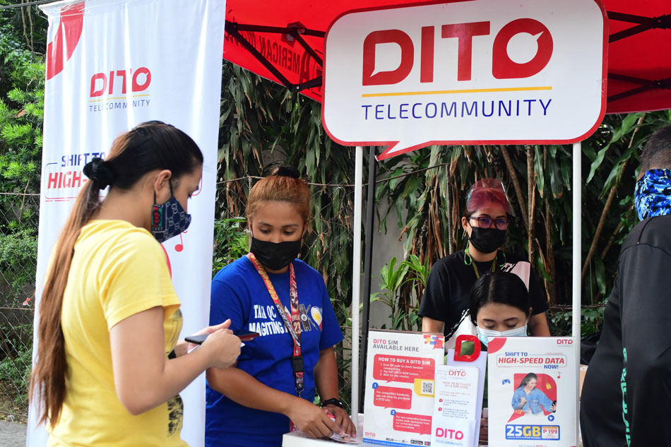 A DITO Telecommunity booth sells sim cards in Quezon City on May 31, 2021. Mark Demayo, ABS-CBN News/File