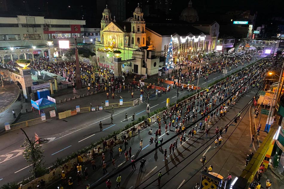 Catholic devotees observe physical distancing while attending mass in commemoration of the annual Traslacion of the Black Nazarene outside the Quiapo church in Manila on Jan. 8, 2021. Thousands of devotees lined up for the “pagtanaw” or “pagpupugay” with the cancellation of the annual procession due to the COVID-19 pandemic. Jonathan Cellona, ABS-CBN News/FILE