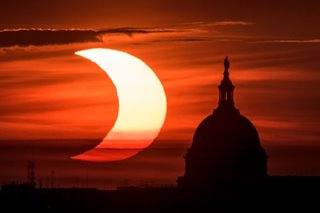 Partial eclipse sweeps over northern hemisphere