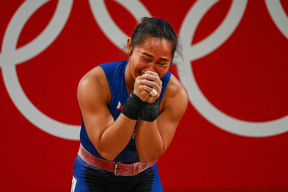 Philippines' Hidilyn Diaz reacts after placing first in the women's 55kg weightlifting competition during the Tokyo 2020 Olympic Games at the Tokyo International Forum in Tokyo on July 26, 2021. Vincenzo Pinto, AFP
