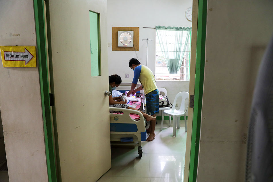 A couple care for their newborn baby at a lying-in clinic in Taytay, Rizal on May 7, 2021. Jonathan Cellona, ABS-CBN News/file