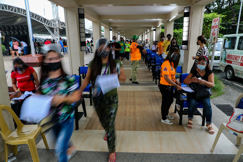  Quezon City residents fall in line to be vaccinated against COVID-19 at the Quezon City Hall on August 13, 2021. Jonathan Cellona, ABS-CBN News