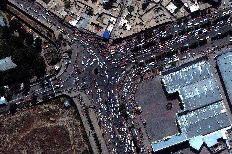 An overview of crowds and traffic at an entrance to Kabul's airport, Afghanistan, August 23, 2021. Satellite image by Maxar Technologies/Handout via Reuters