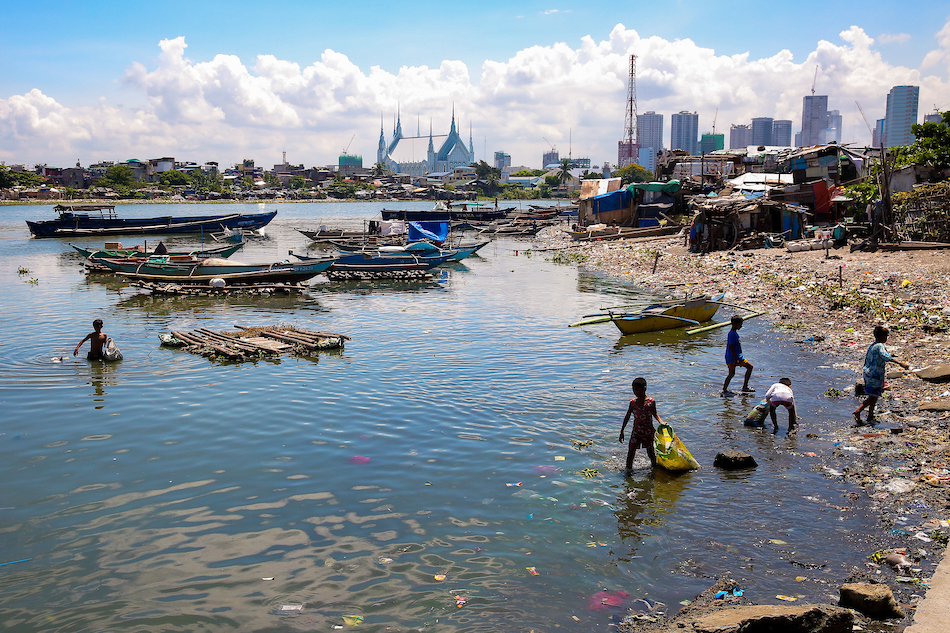 Children gather garbage near the mouth of Pasig river that connects it to Manila Bay in Baseco Compound in Tondo, Manila on World Environment Day, June 5, 2021. George Calvelo, ABS-CBN News