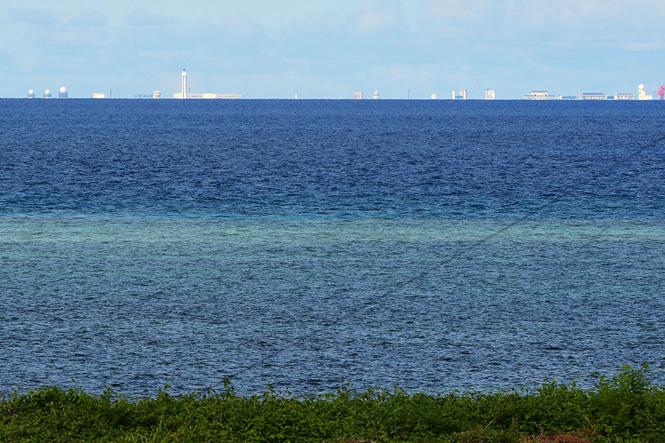 General view of Chinese-claimed reef Subi as seen from Philippine-claimed island of Thitu in The Spratlys on April 21, 2017